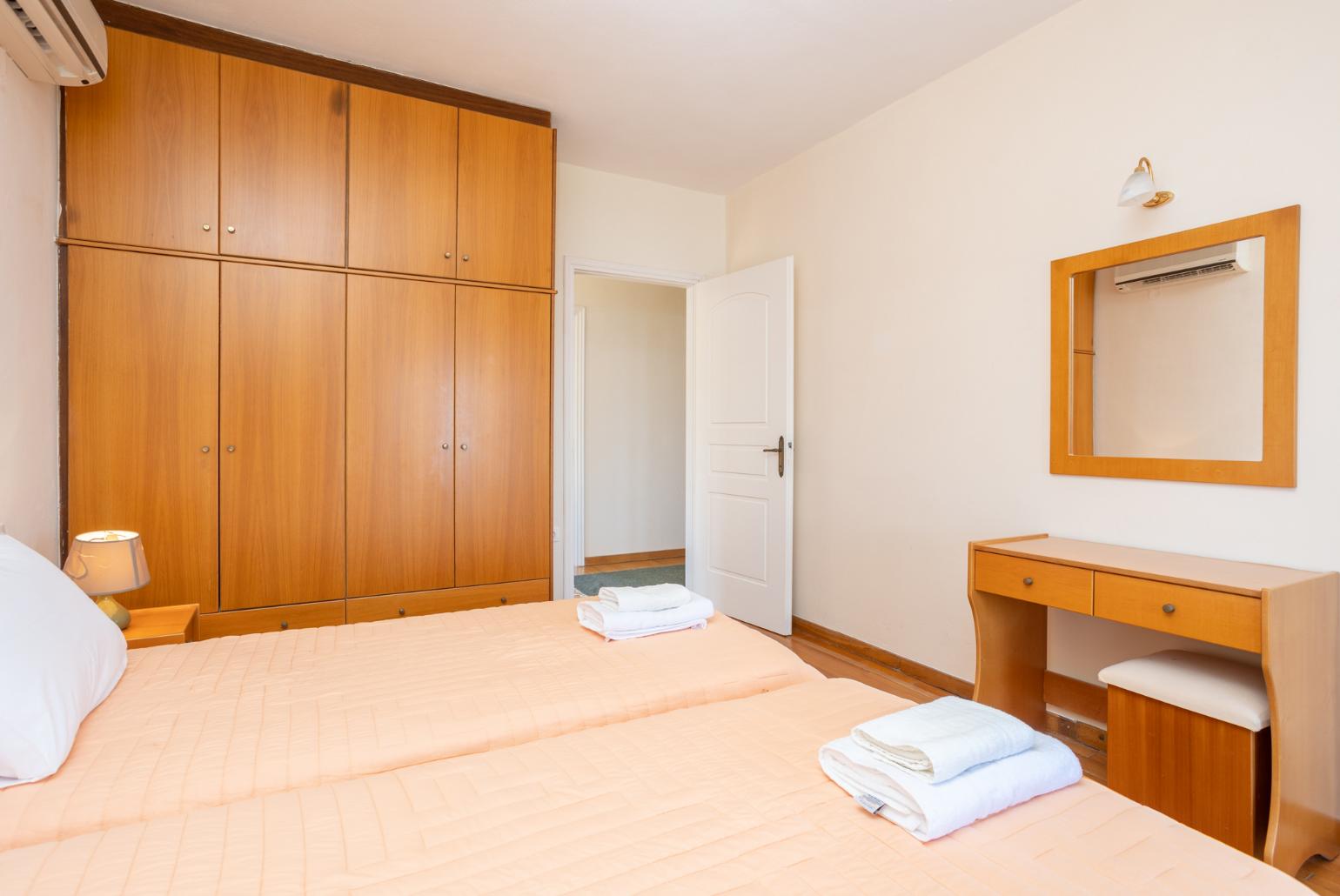 Twin bedroom with A/C and balcony access with panoramic sea views