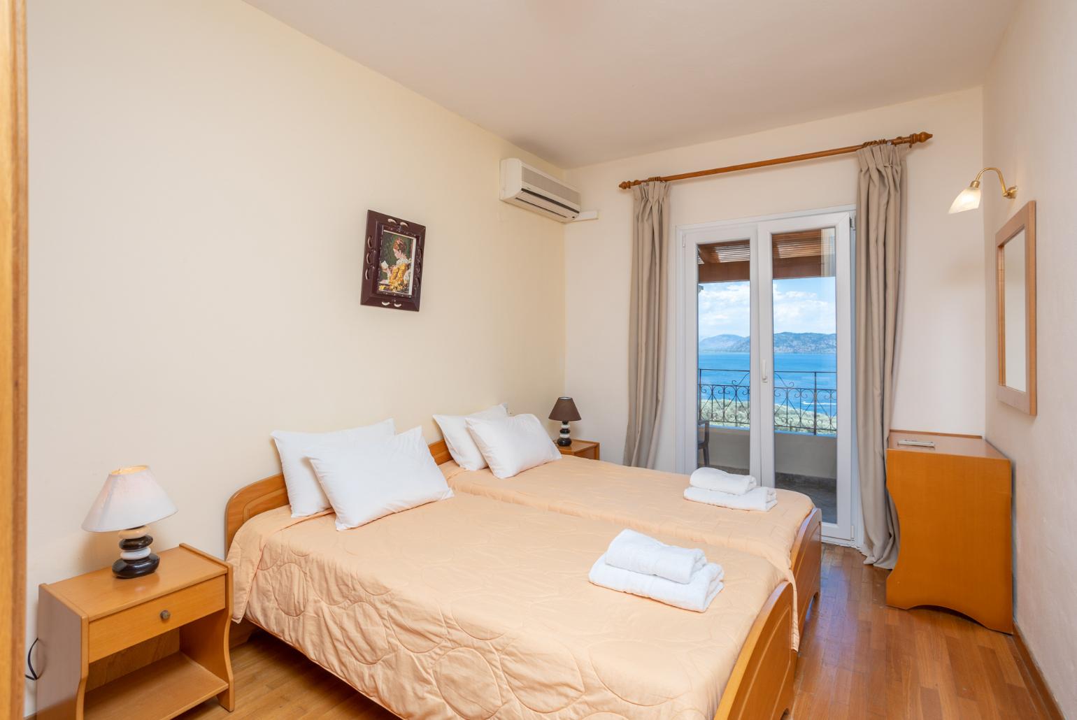 Twin bedroom with A/C and balcony access with panoramic sea views