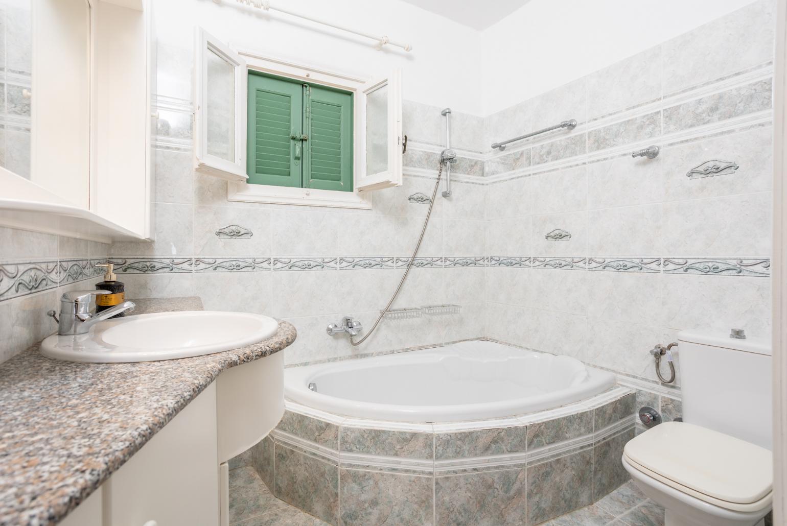 Family bathroom with bath and shower