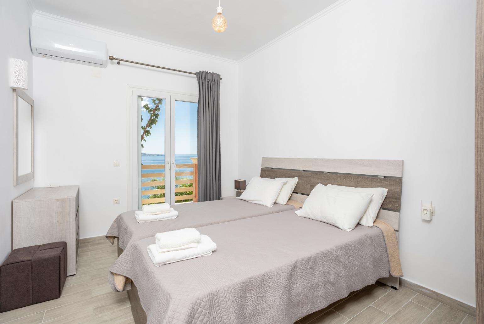 Twin bedroom with A/C and sea views