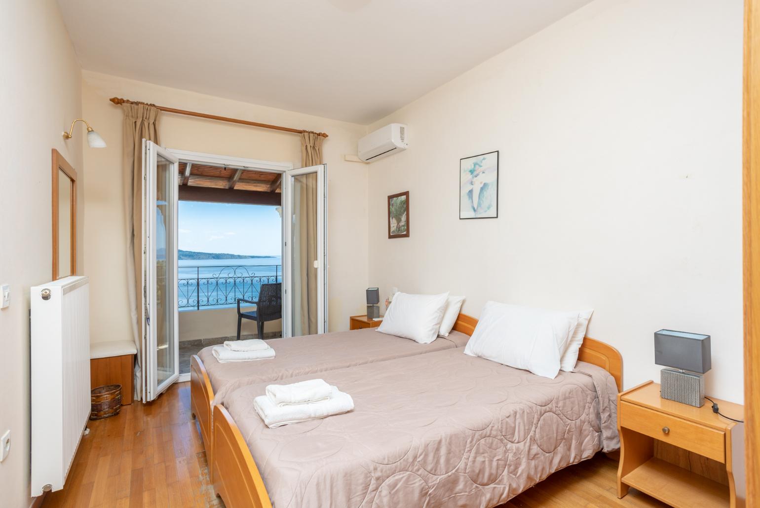 Twin bedroom with A/C and balcony access with panoramic sea views