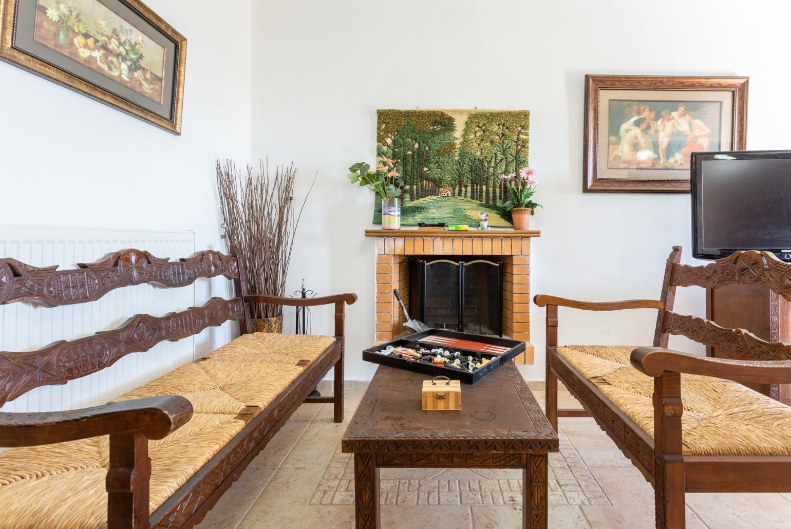 Second living room with sofas, dining area, kitchen, pool table, table football, ornamental fireplace, WiFi internet, satellite TV, and terrace access