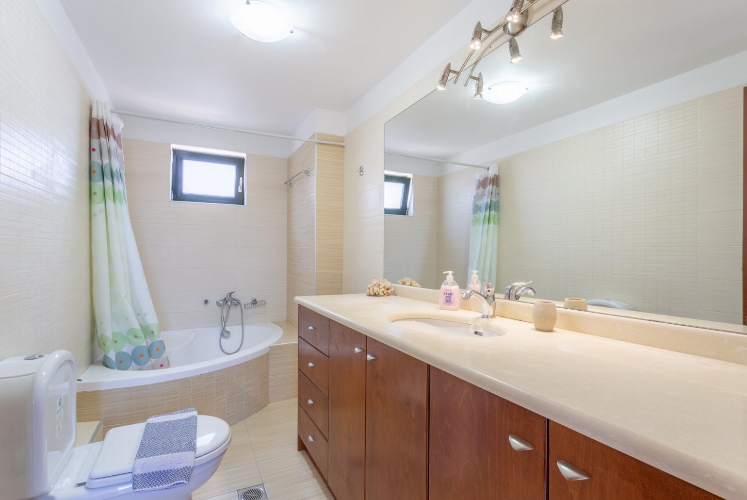 Family bathroom with bath and shower