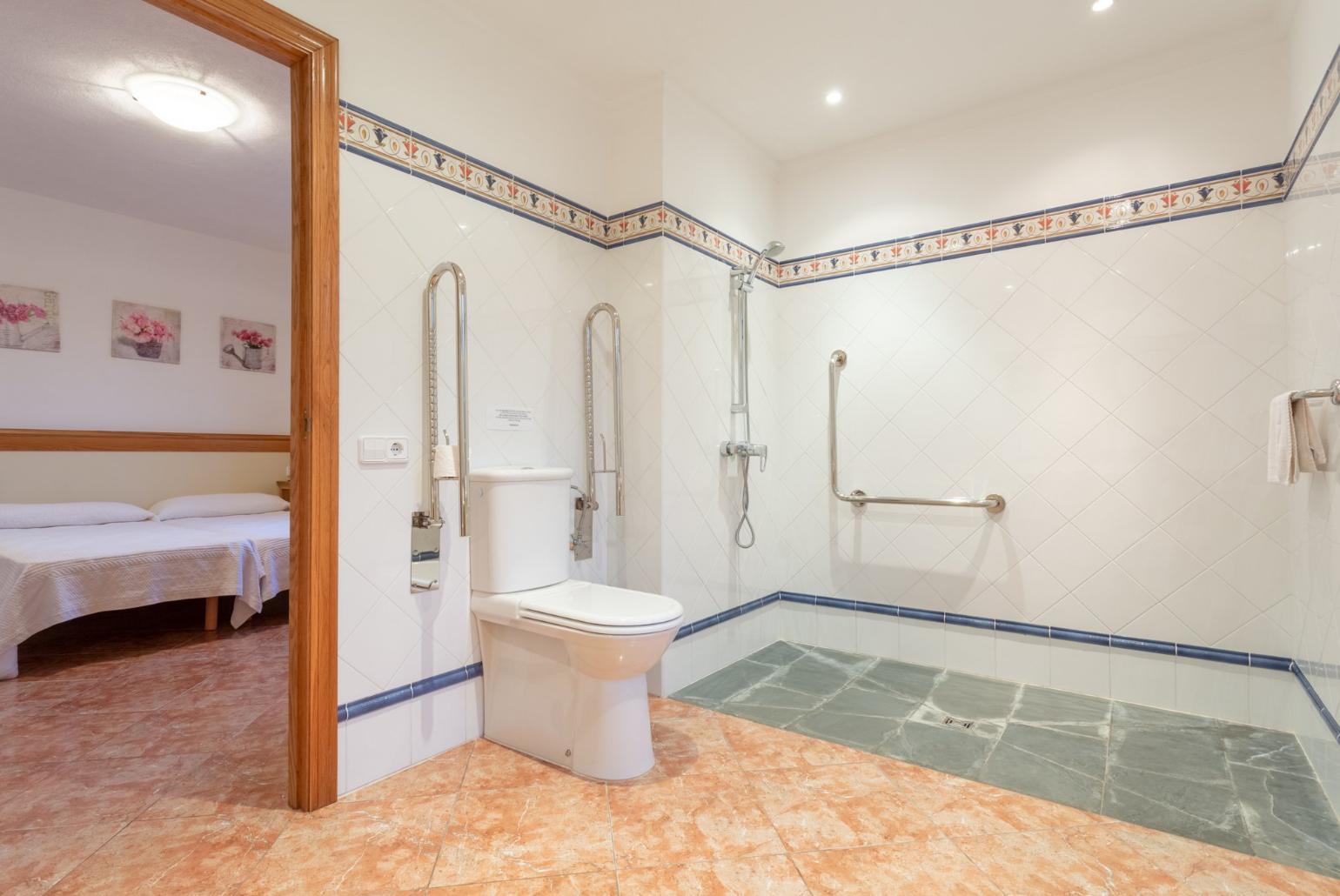 Disability-friendly en suite bathroom with shower