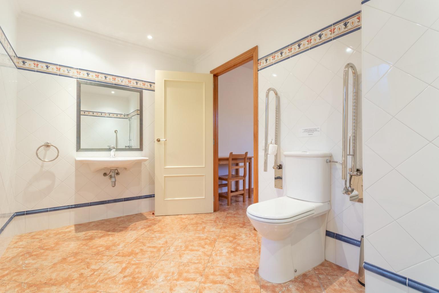 Disability-friendly en suite bathroom with shower