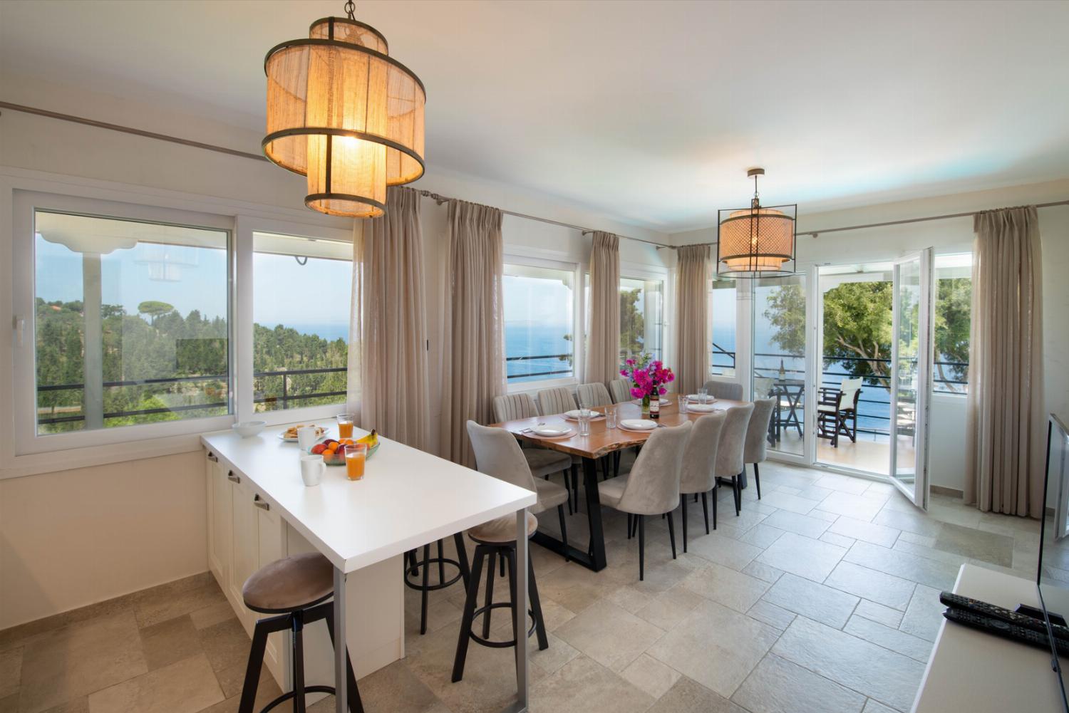 Kitchen and dining table with panoramic sea views
