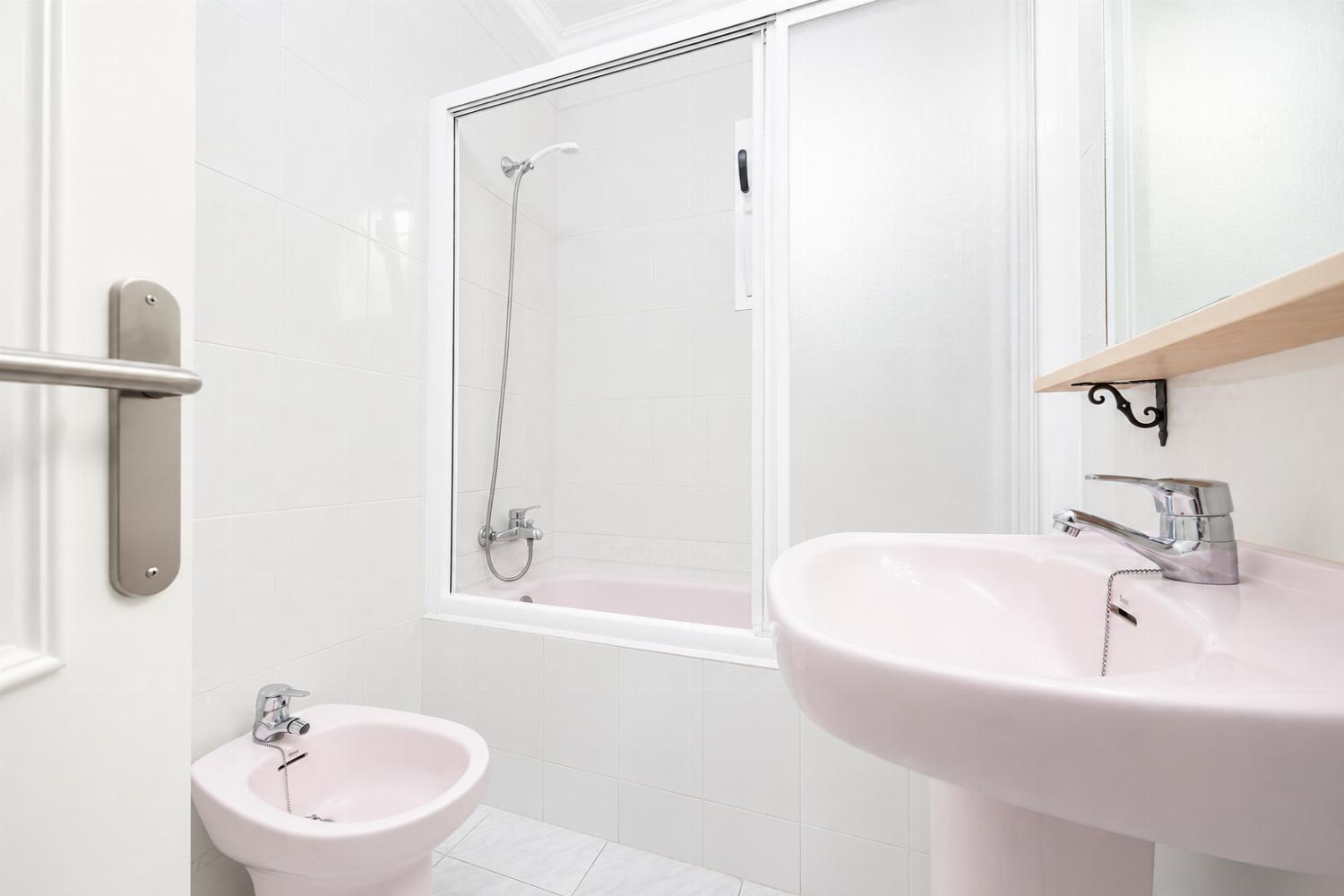 Family bathroom with bath and shower