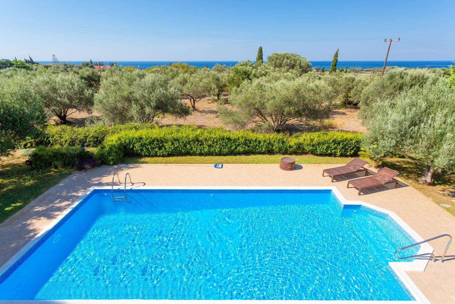 View of pool and sea from balcony