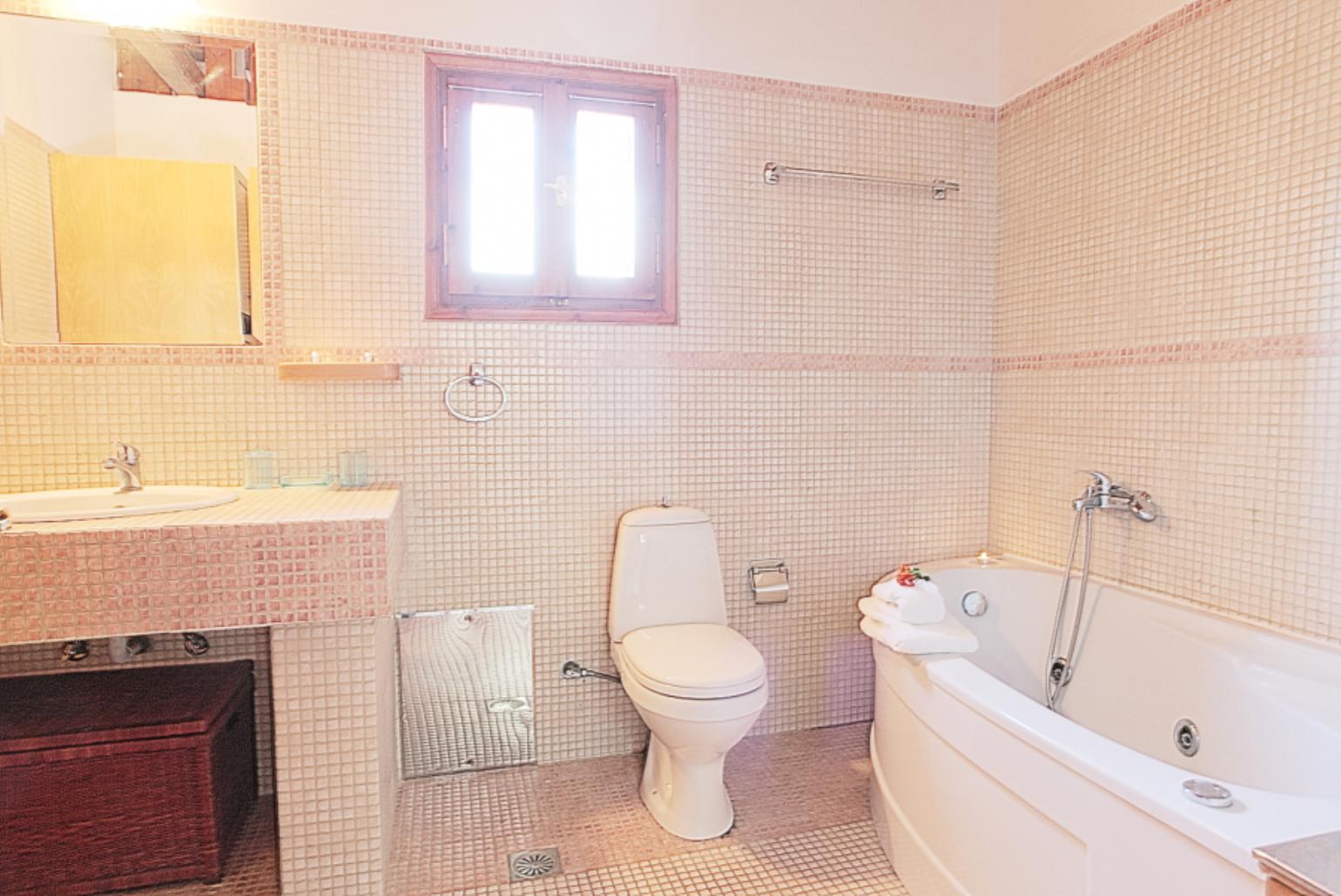 Bathroom with bath and shower