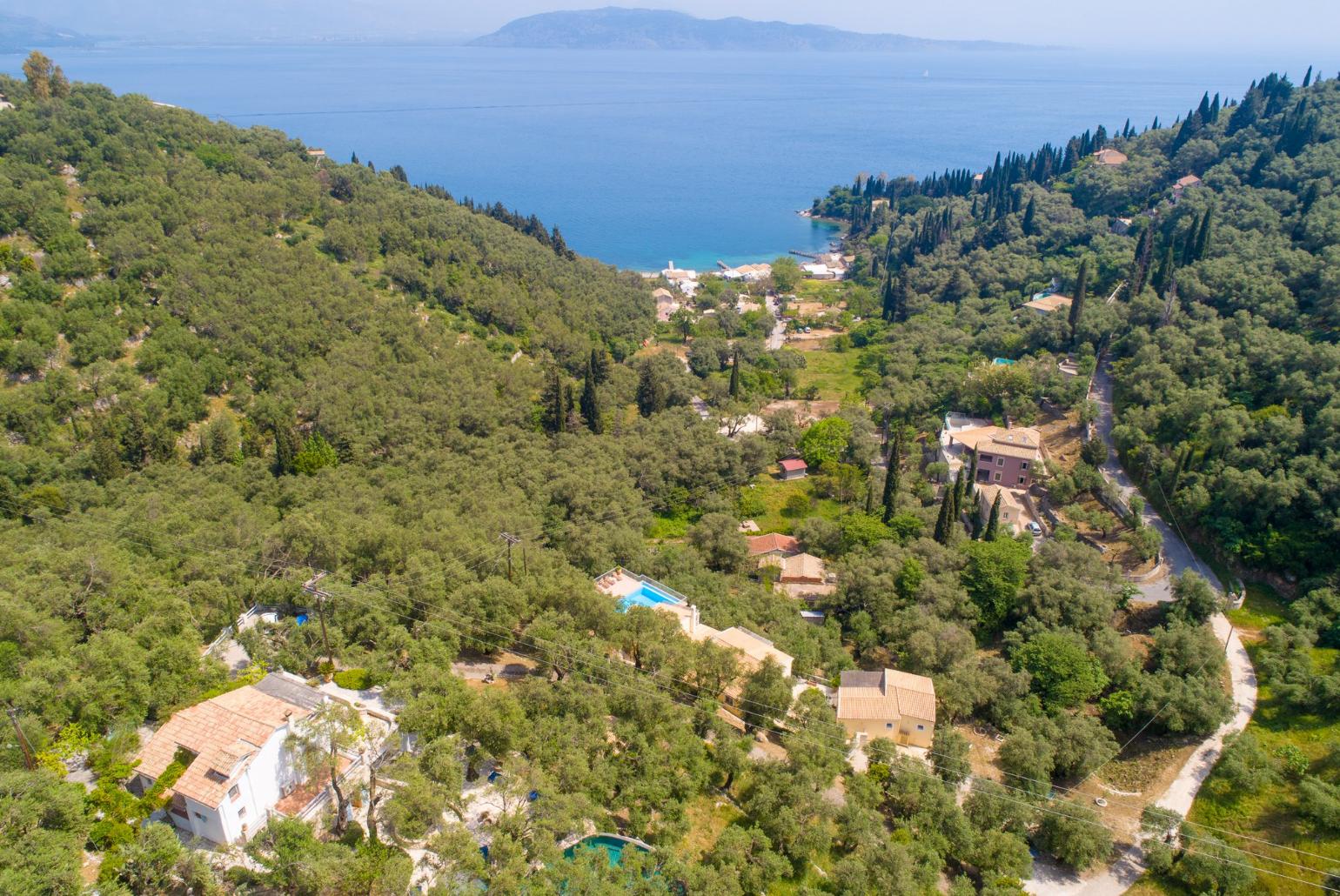 Aerial shot of the Olive Press with view towards Agni Bay