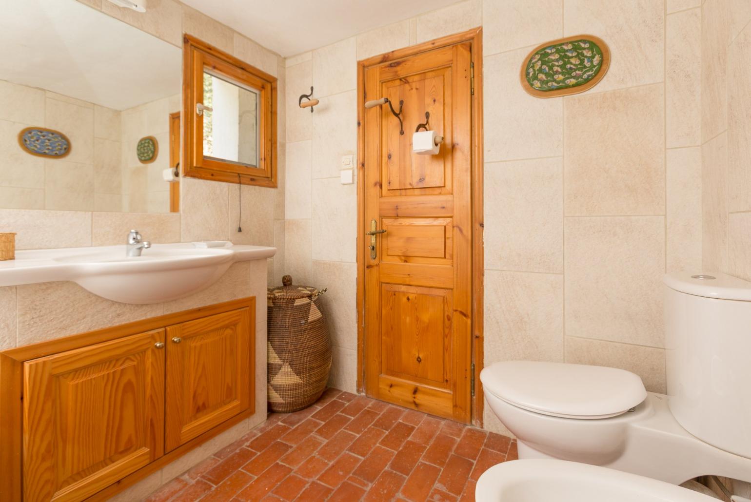 Family bathroom with bath and overhead shower