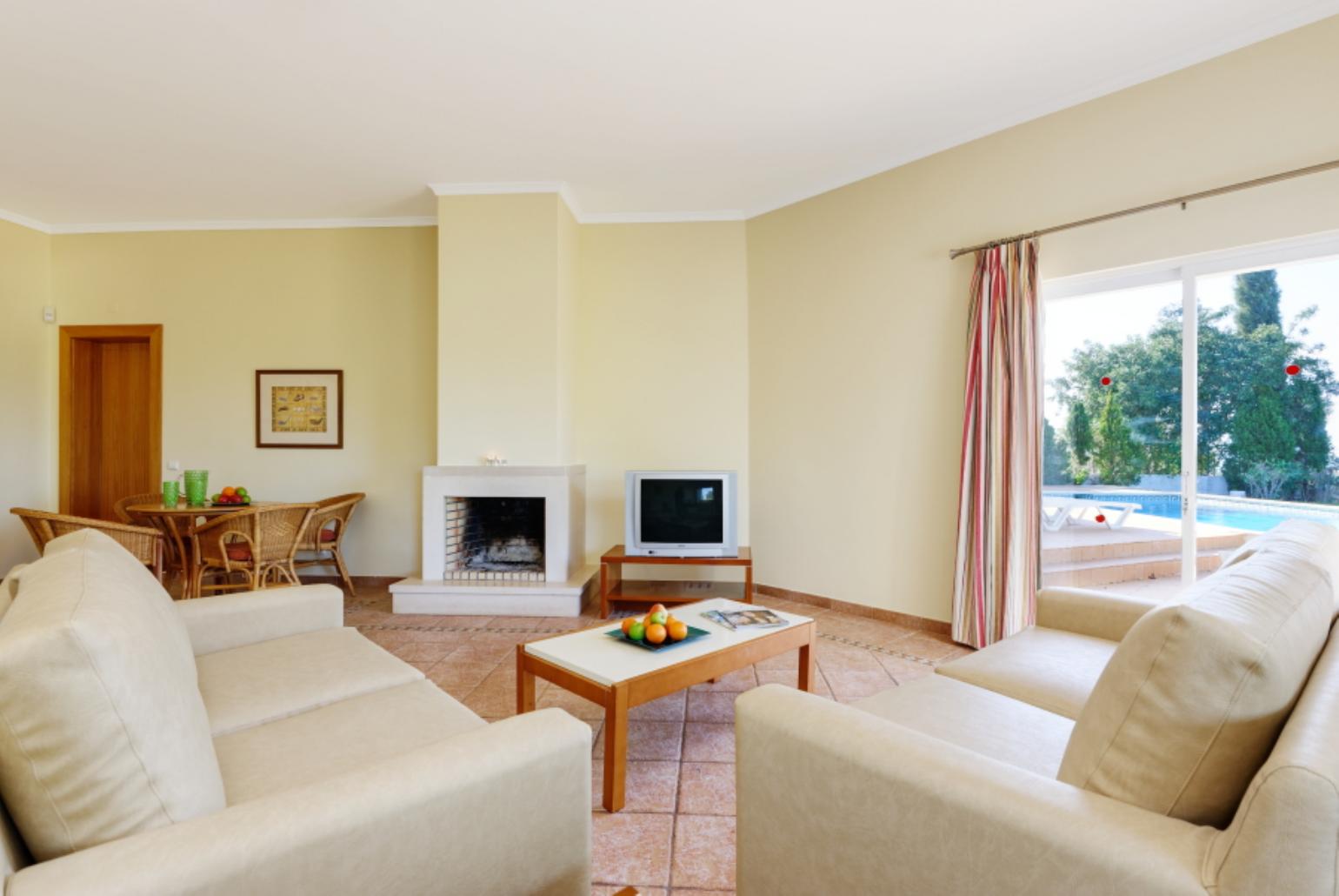 Living room with WiFi, TV, DVD player and terrace access