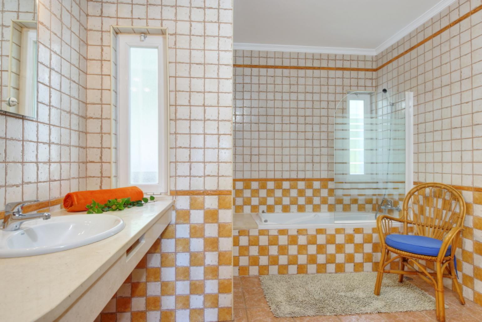 Bathroom with bath and overhead shower