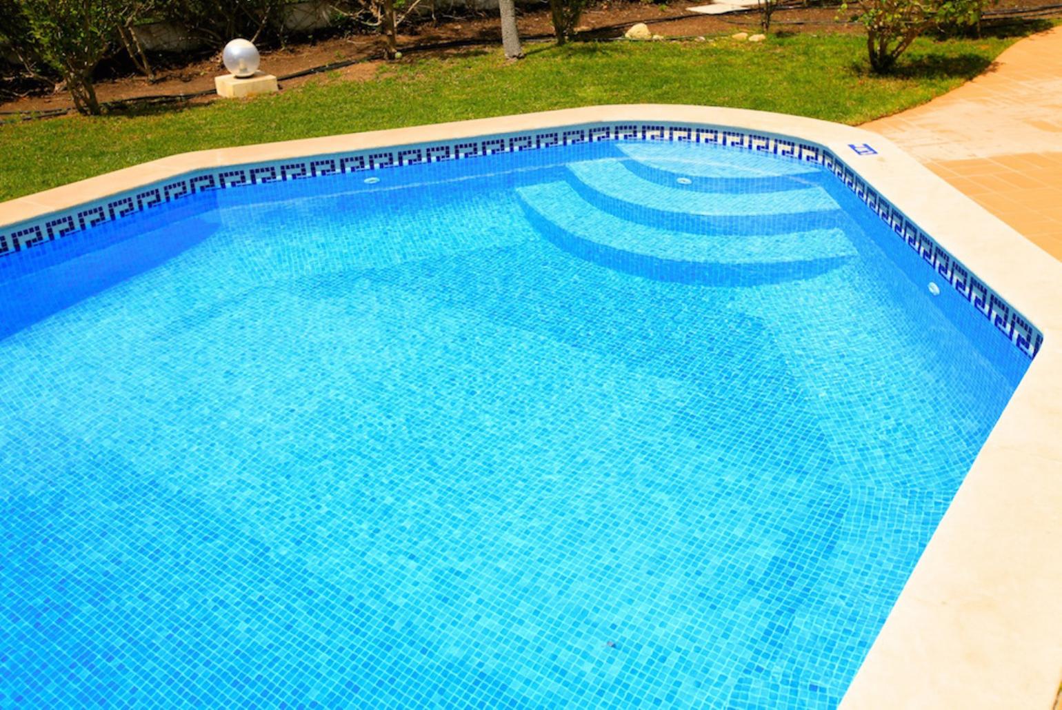 ,Private pool with terrace and garden area