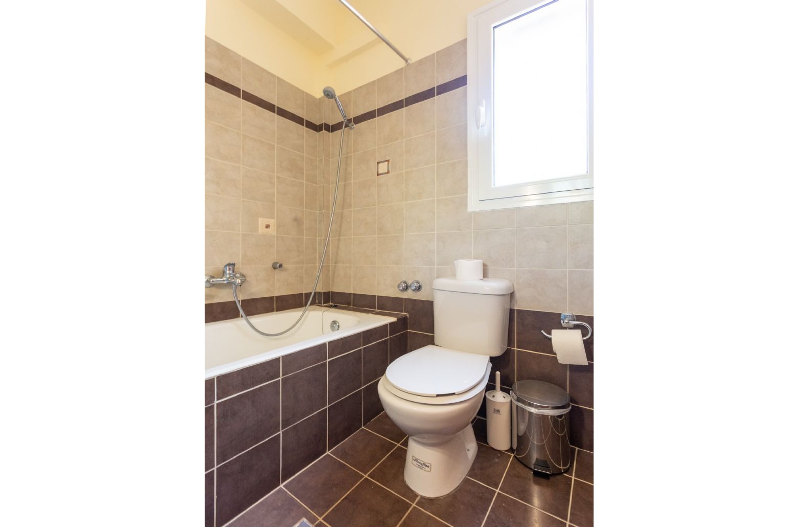 En suite bathroom with bath and overhead shower