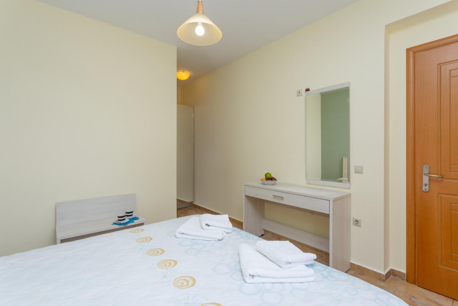 Double bedroom with en suite bathroom, A/C, and pool terrace access