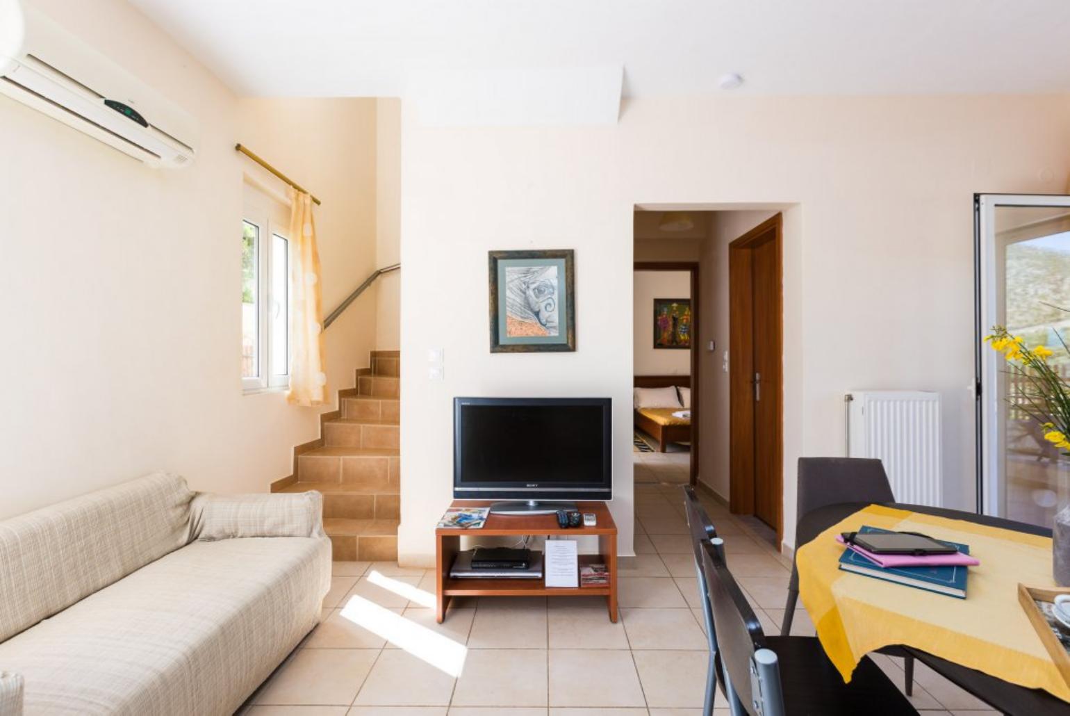 Open plan living area with WiFi, TV, DVD Player and terrace access