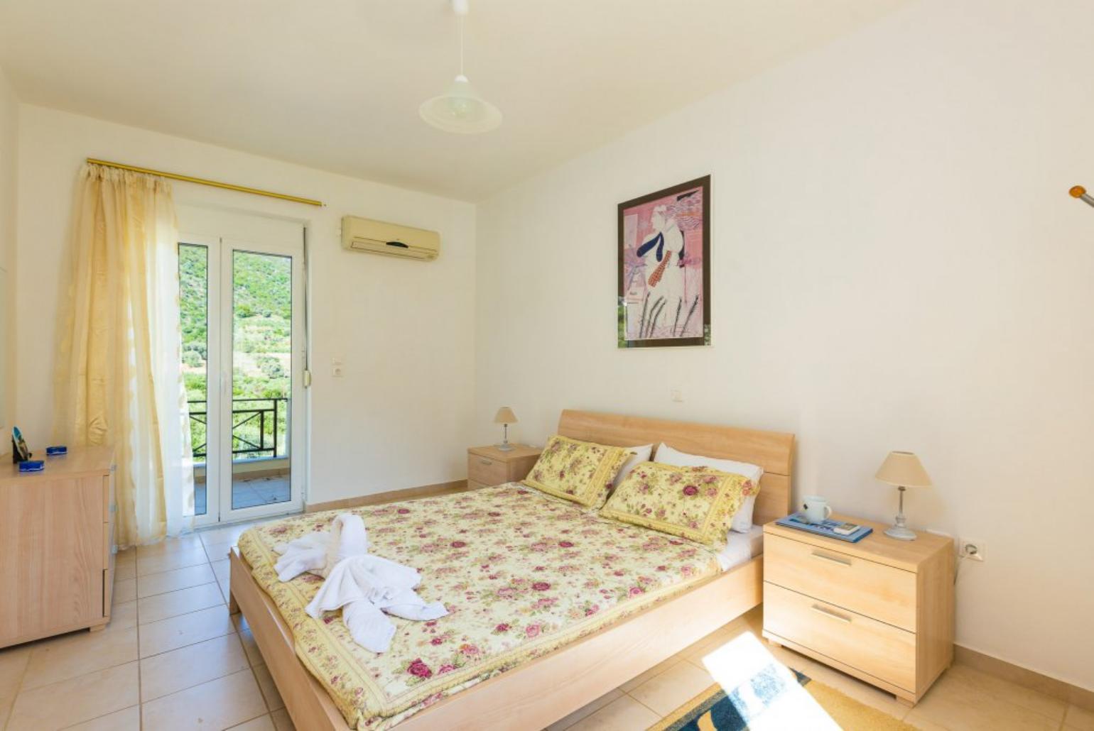 Double bedroom with A/C and balcony access