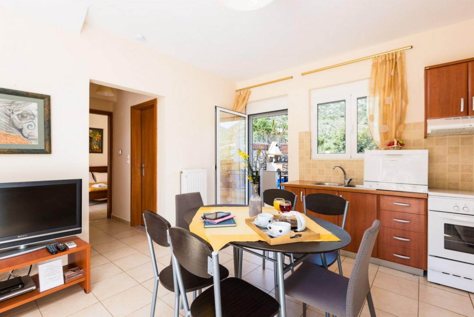 Open plan living area with WiFi, TV, DVD Player and terrace access