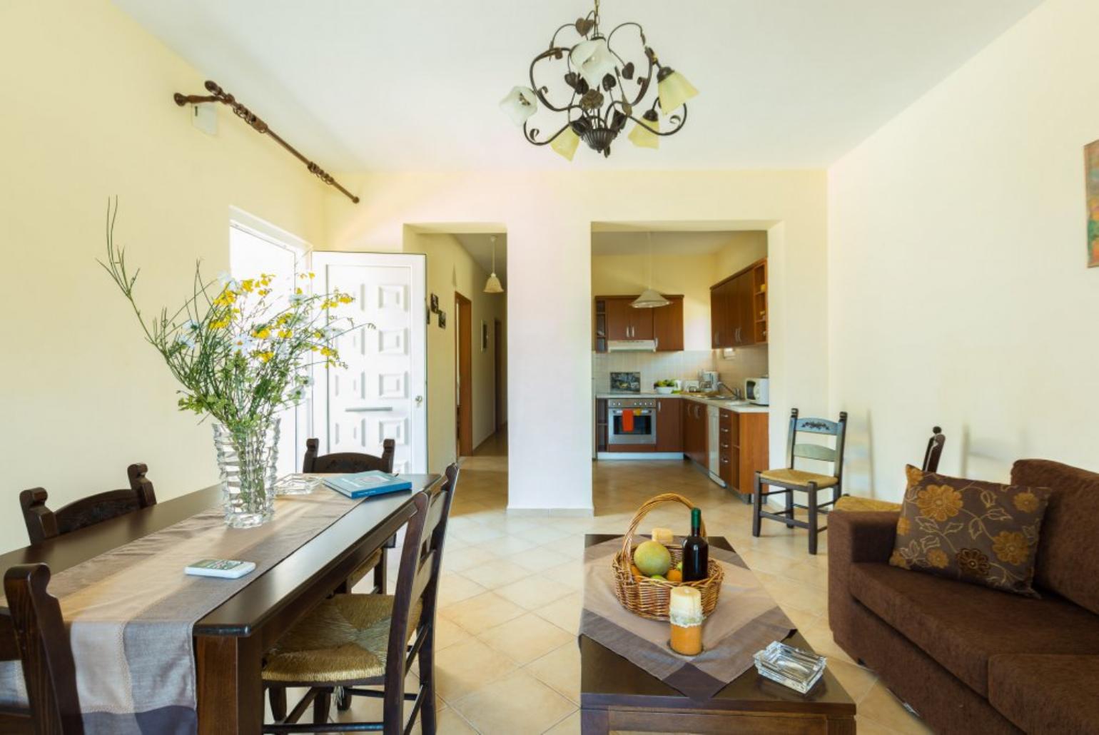 Living and dining area with WiFi, TV, DVD Player and terrace access