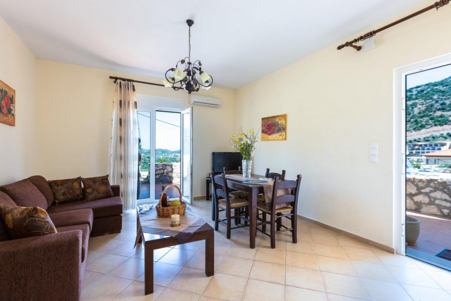 Living and dining area with WiFi, TV, DVD Player and terrace access