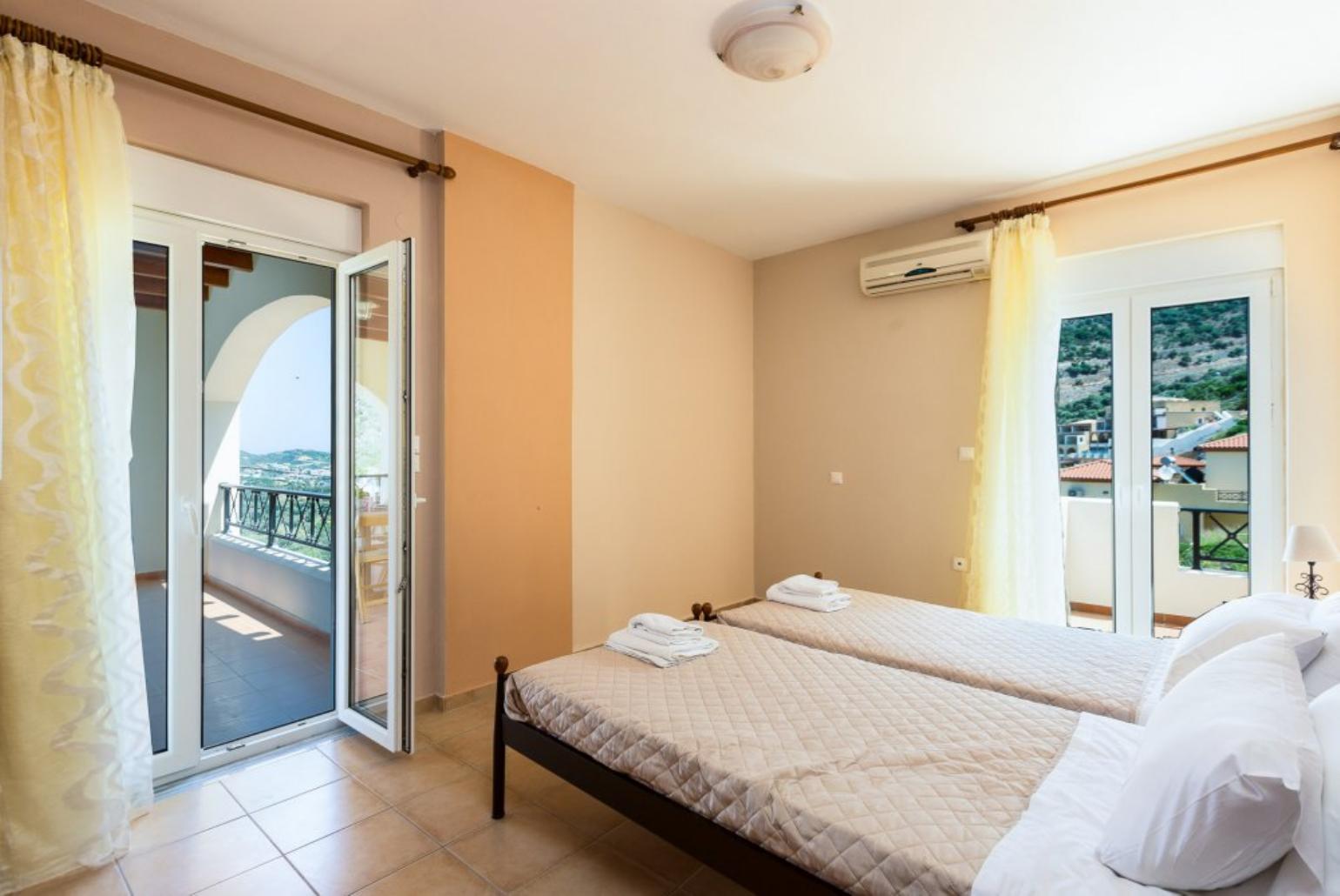 Twin bedroom with A/C and balcony access