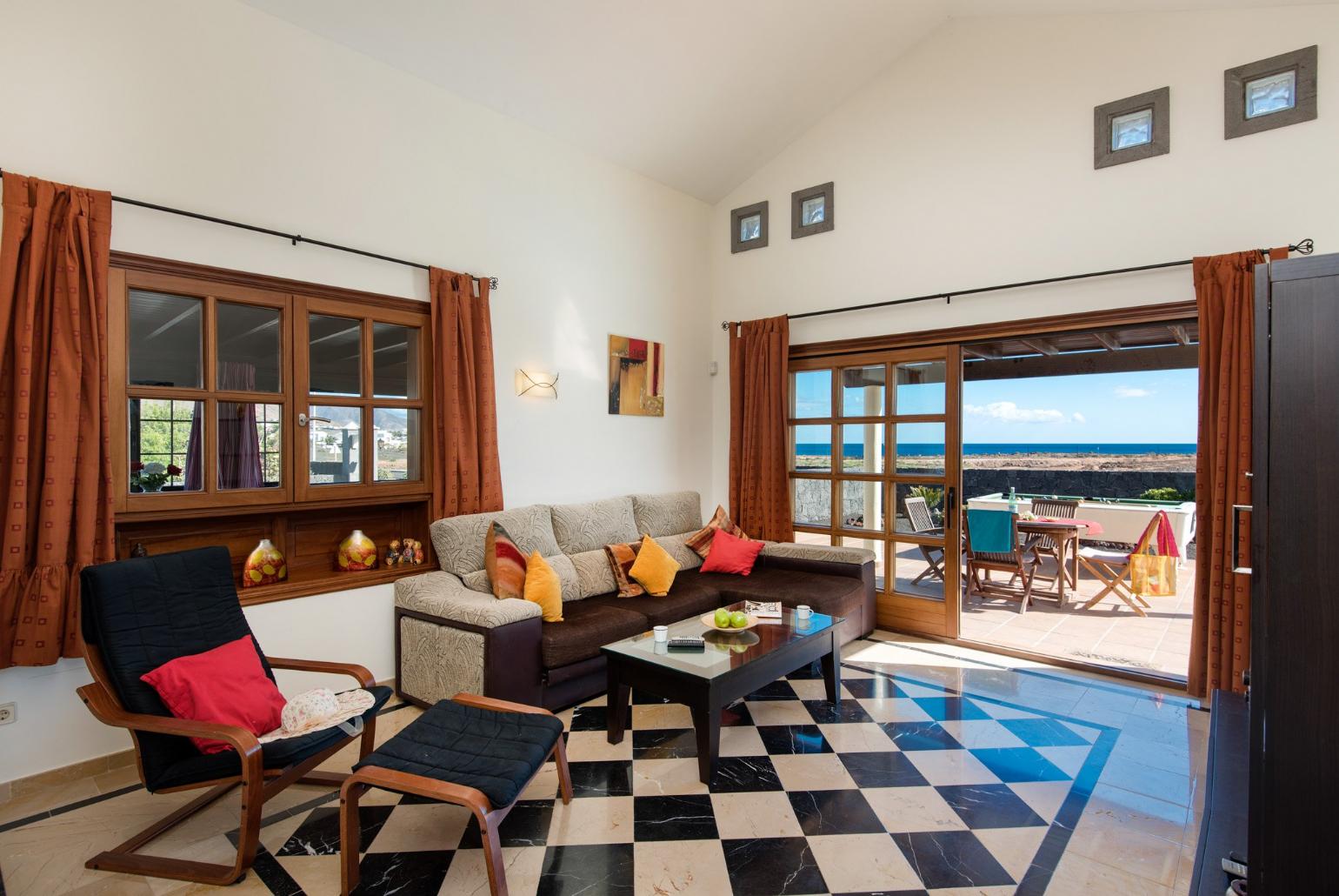 Living area with WiFi, TV, DVD player with terrace access