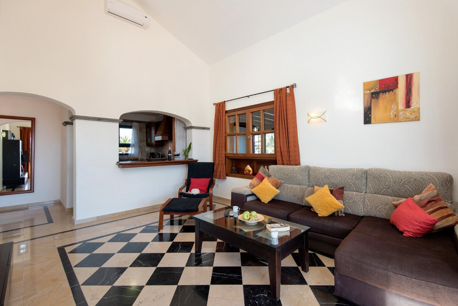 Living area with WiFi, TV, DVD player with terrace access