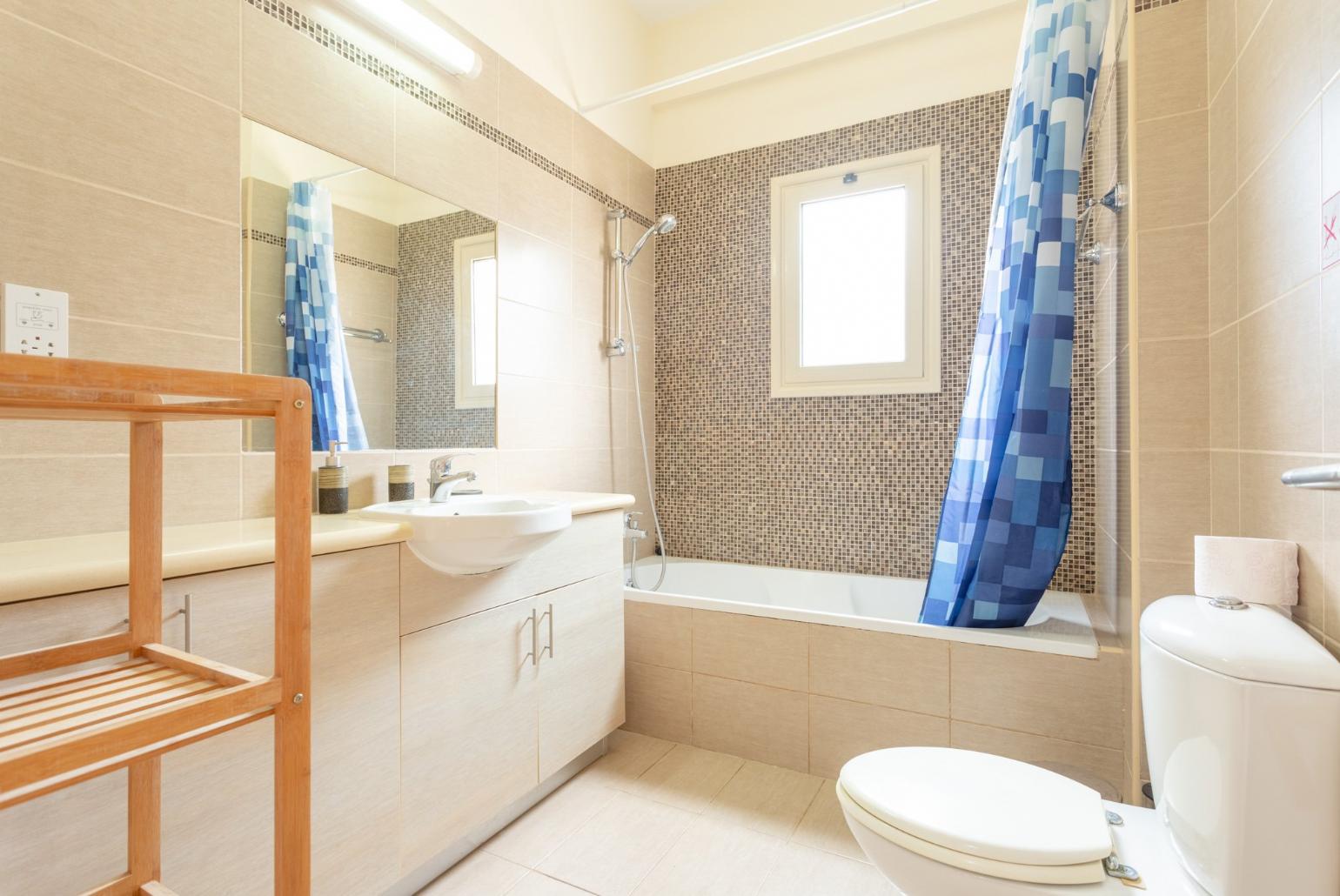 Family bathroom with bath and shower