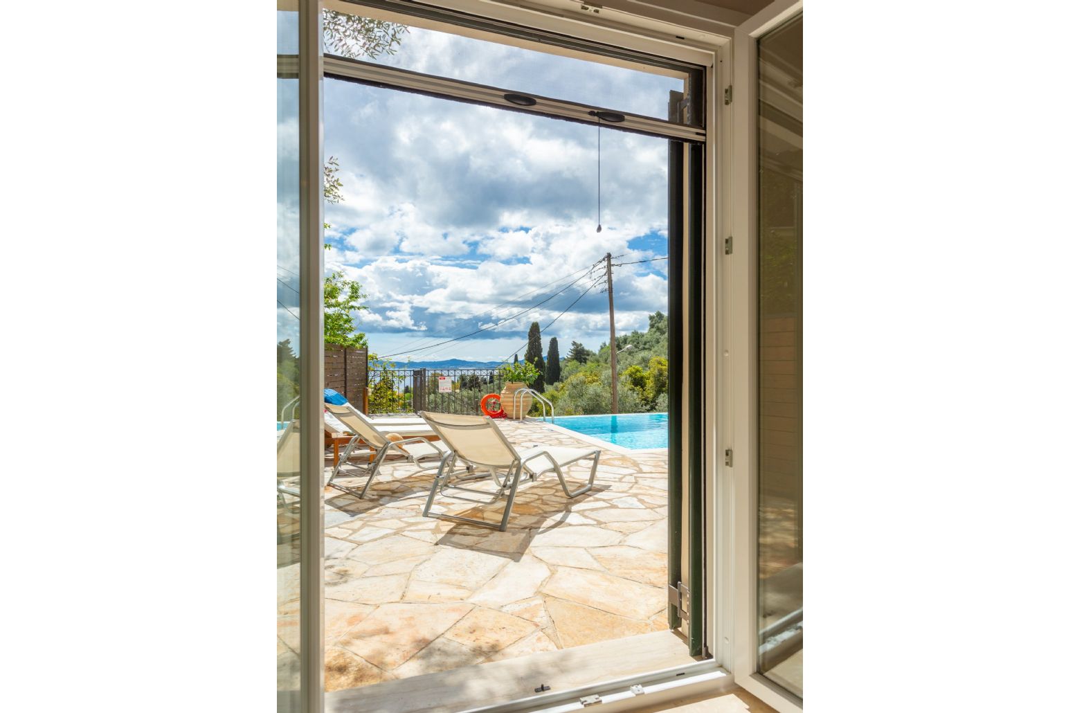 View of pool terrace from bedroom