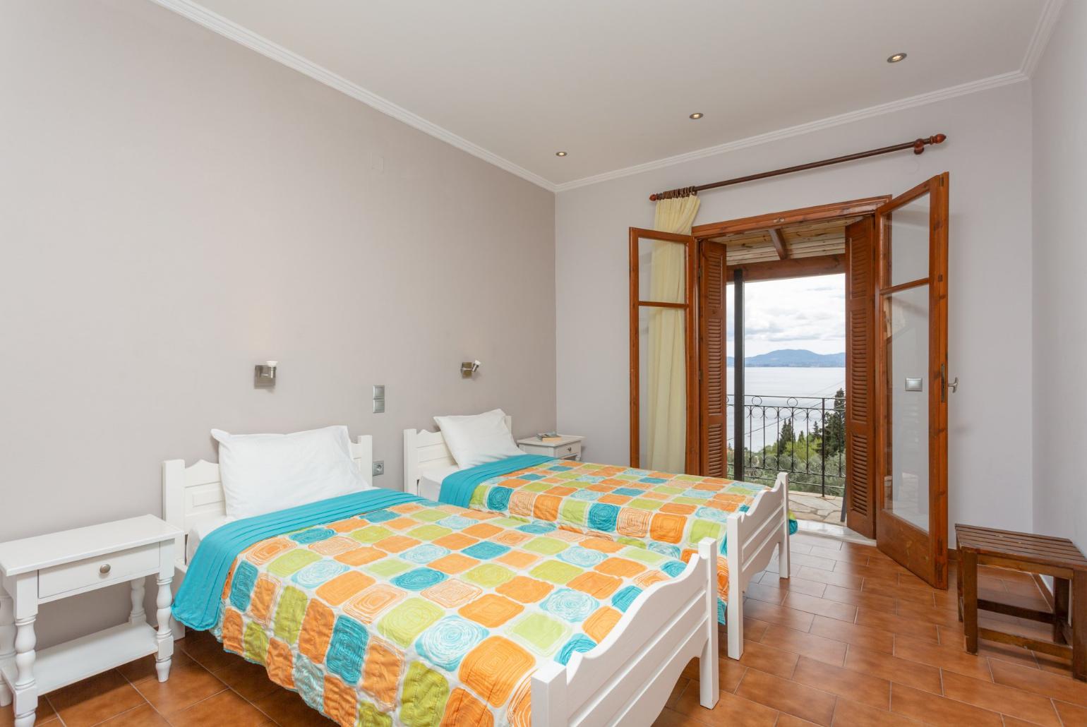Twin bedroom with A/C and balcony access with sea views