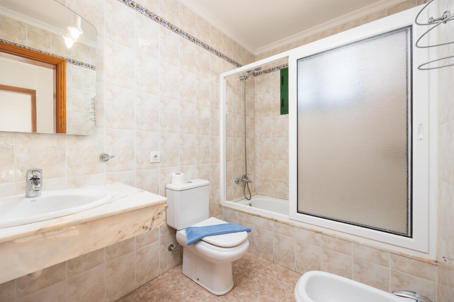 Family bathroom with bath and shower