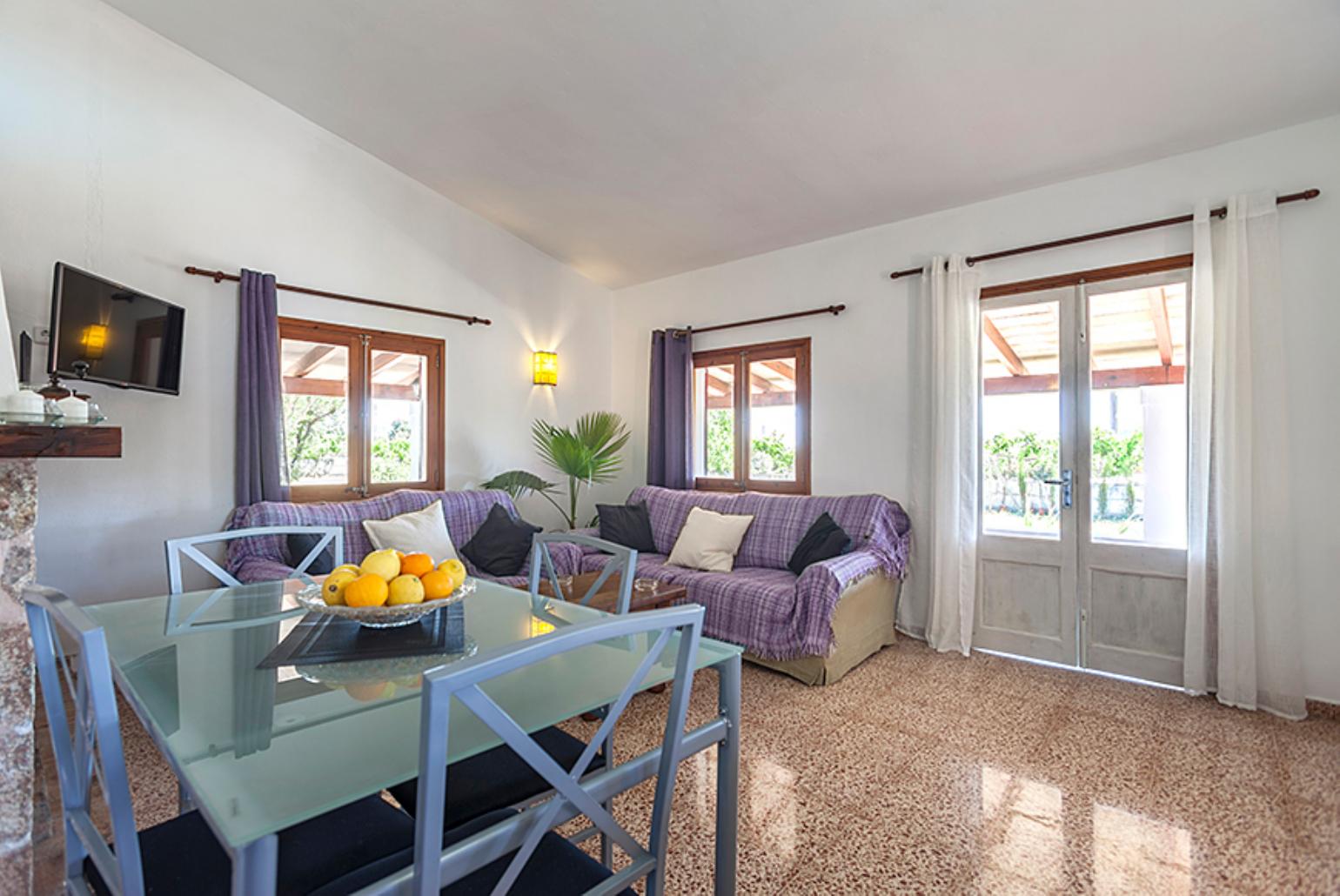 Living and dining area with WiFi, TV, DVD player and terrace access