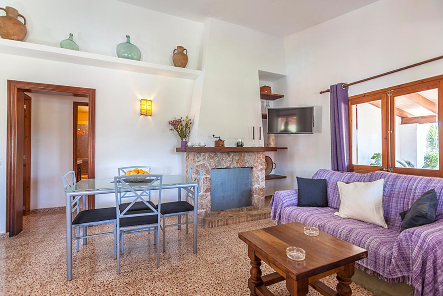Living and dining area with WiFi, TV, DVD player and terrace access