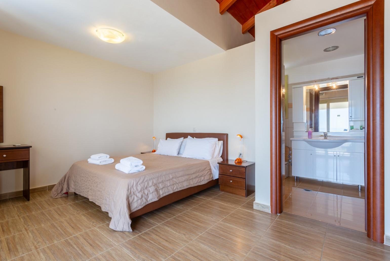 Double bedroom with en suite bathroom and balcony access