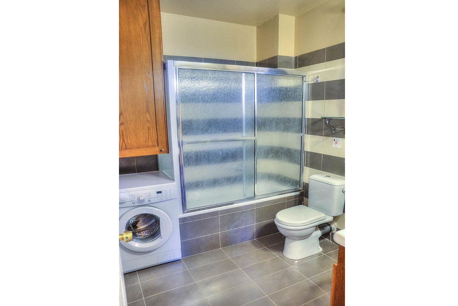 Bathroom with bath and overhead shower