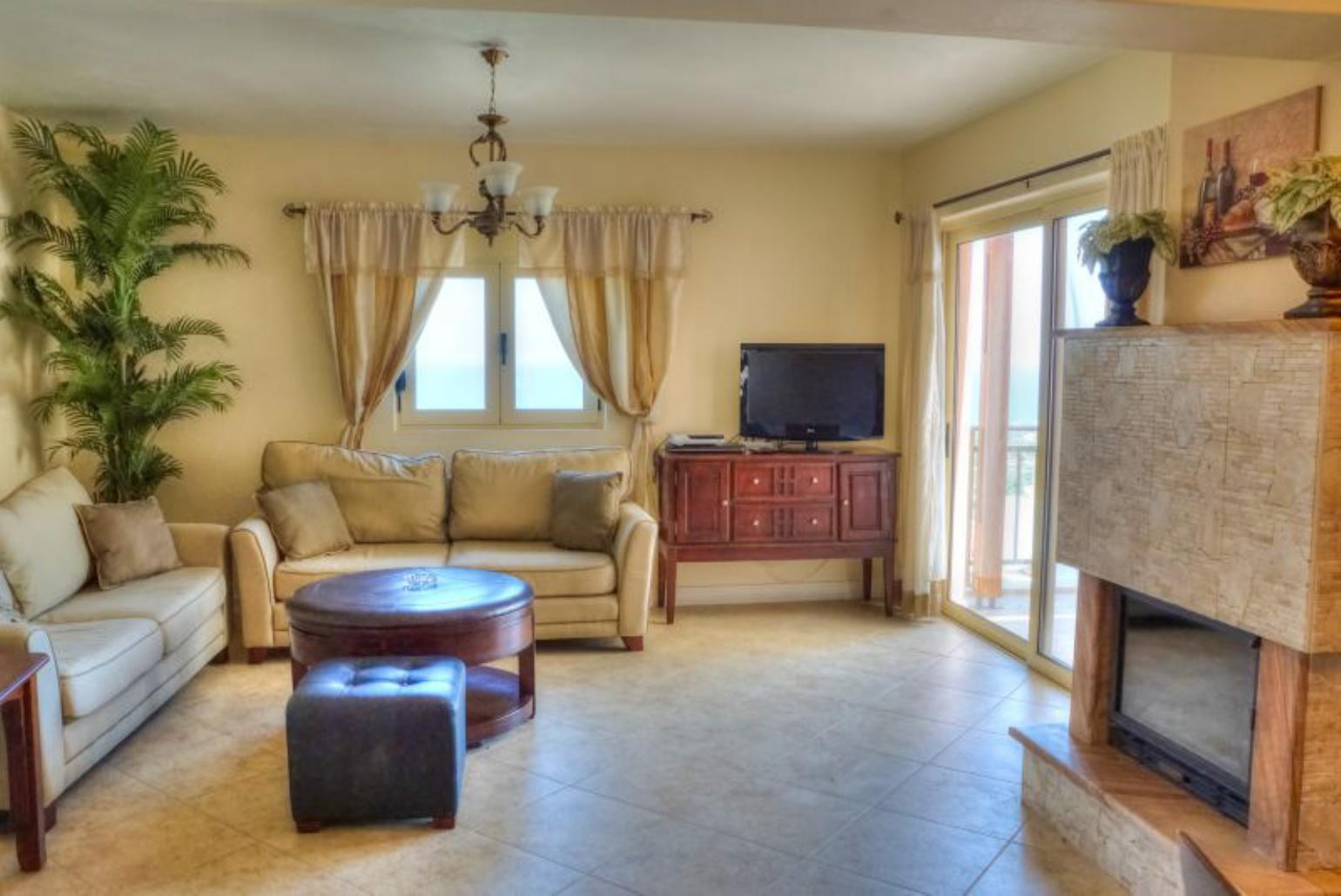 Living room with WiFi, TV, DVD player and terrace access