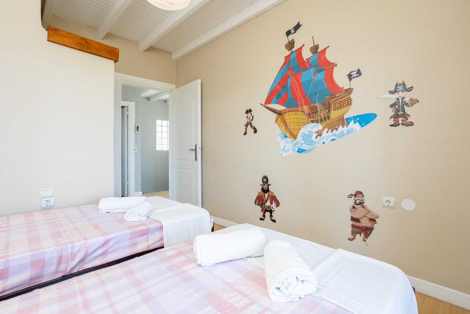Twin bedroom with A/C and balcony access