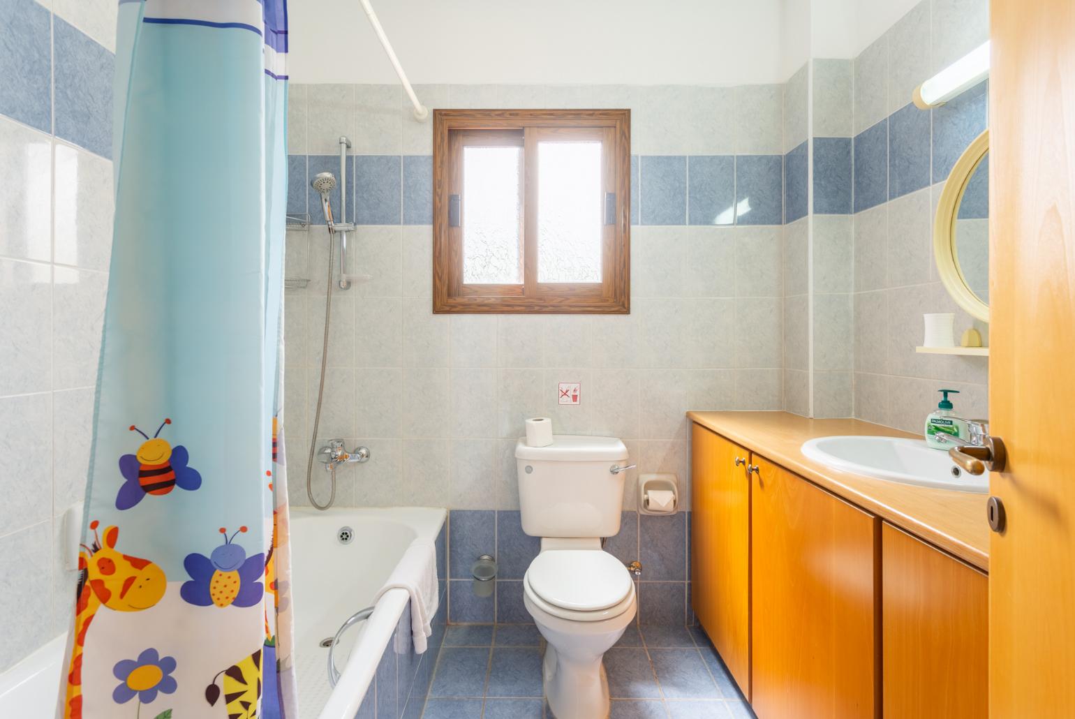 Family bathroom with bath and shower