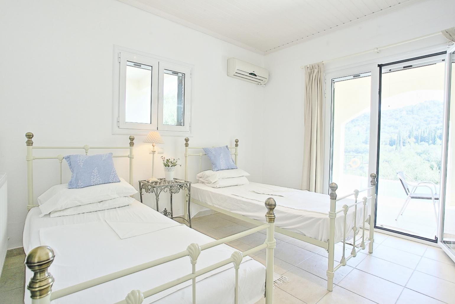 Twin bedroom with A/C, en suite bathroom and terrace access
