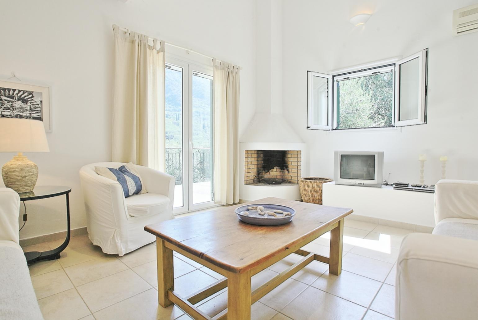 Living room with WiFi, TV, DVD player and balcony access