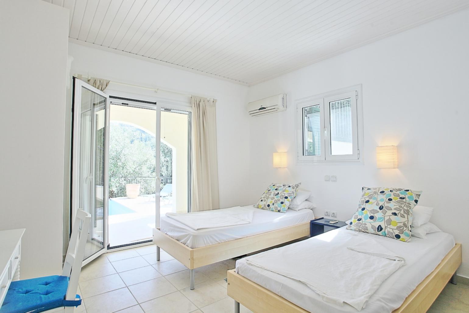 Twin bedroom with A/C, en suite bathroom and terrace access