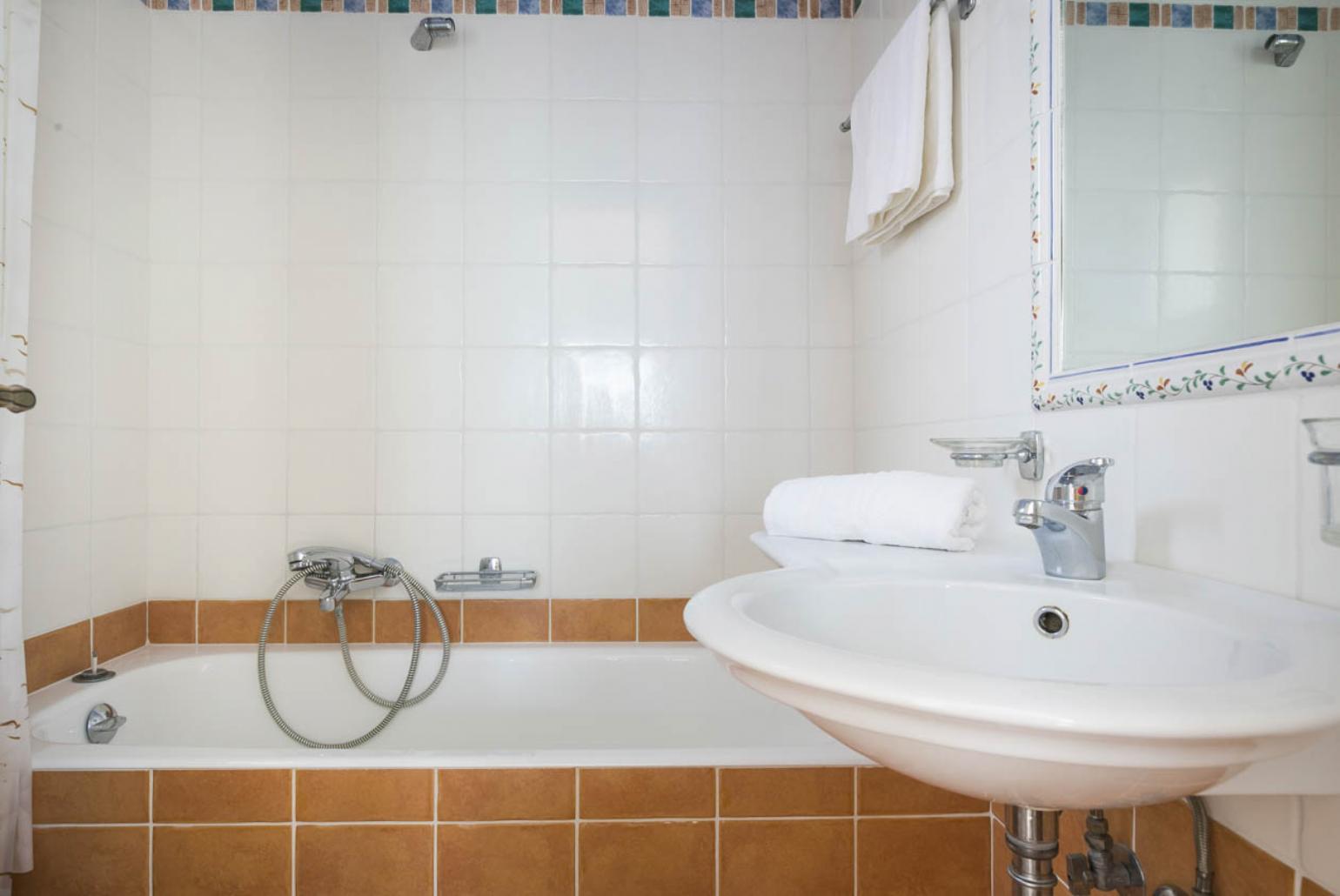 Bathroom with bath and shower