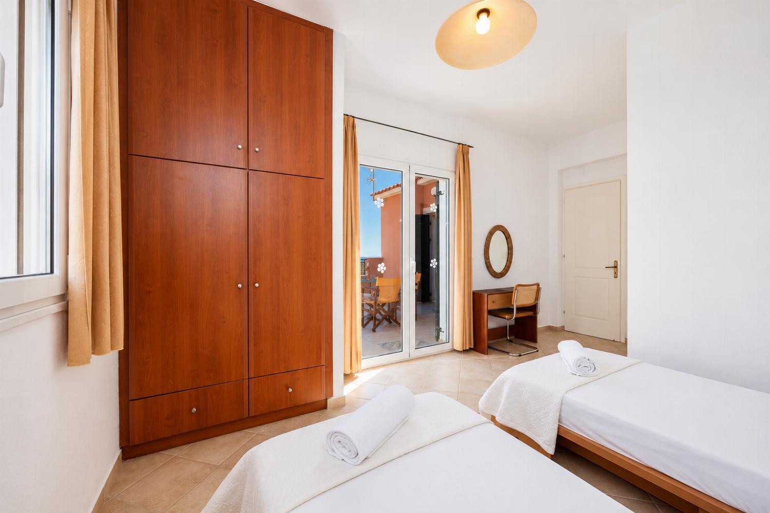 Twin bedroom with en suite bathroom and A/C