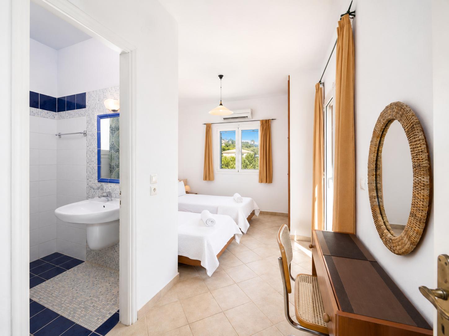 Twin bedroom with en suite bathroom and A/C