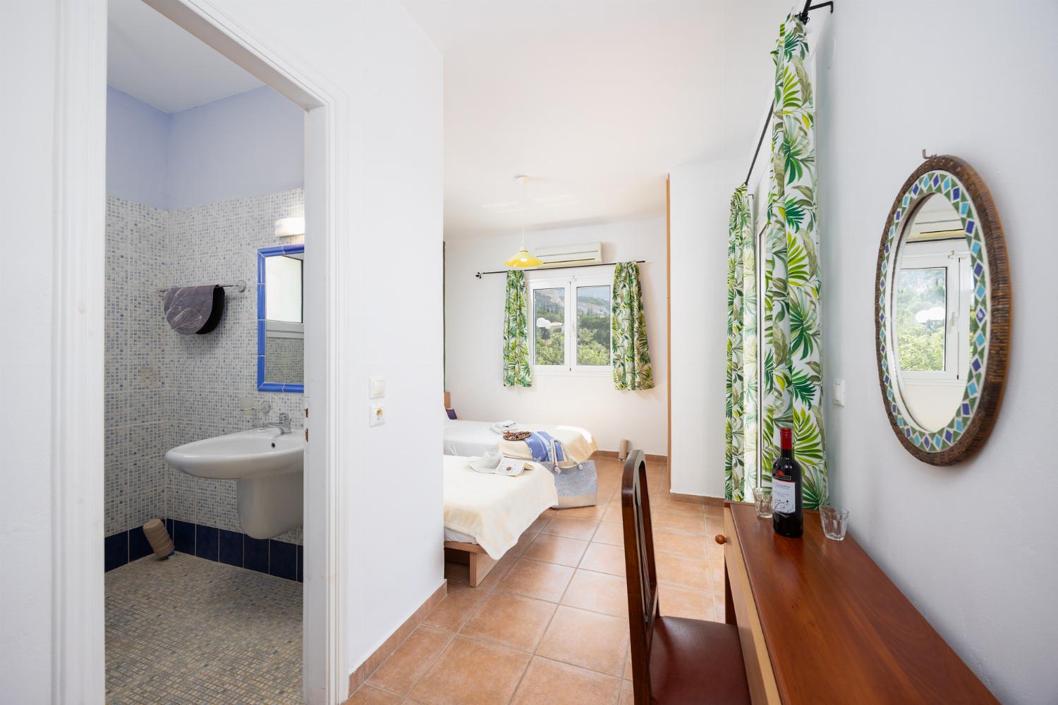 Twin bedroom with en suite bathroom and A/C