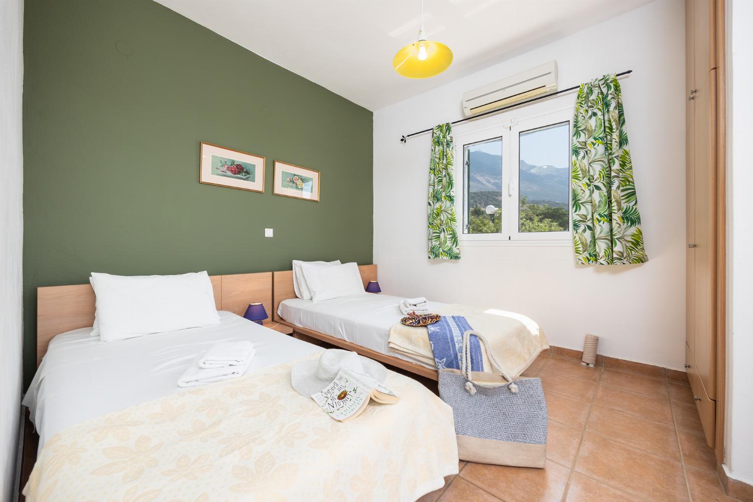 Twin bedroom with en suite bathroom and A/C