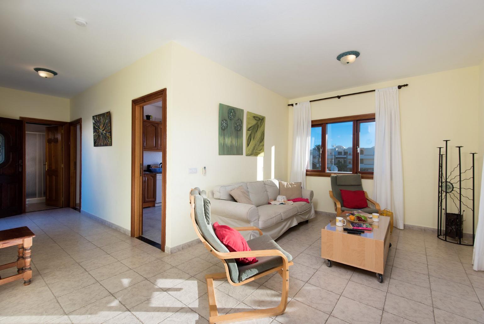 Living room with WiFi, TV, DVD player and terrace access