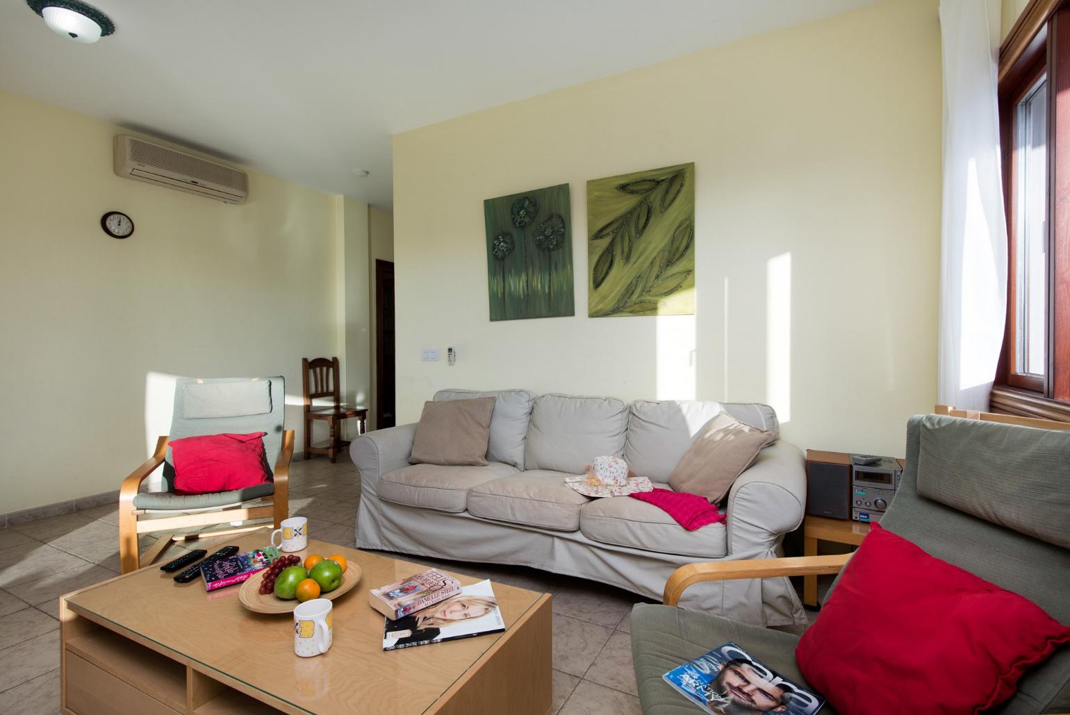 Living room with WiFi, TV, DVD player and terrace access