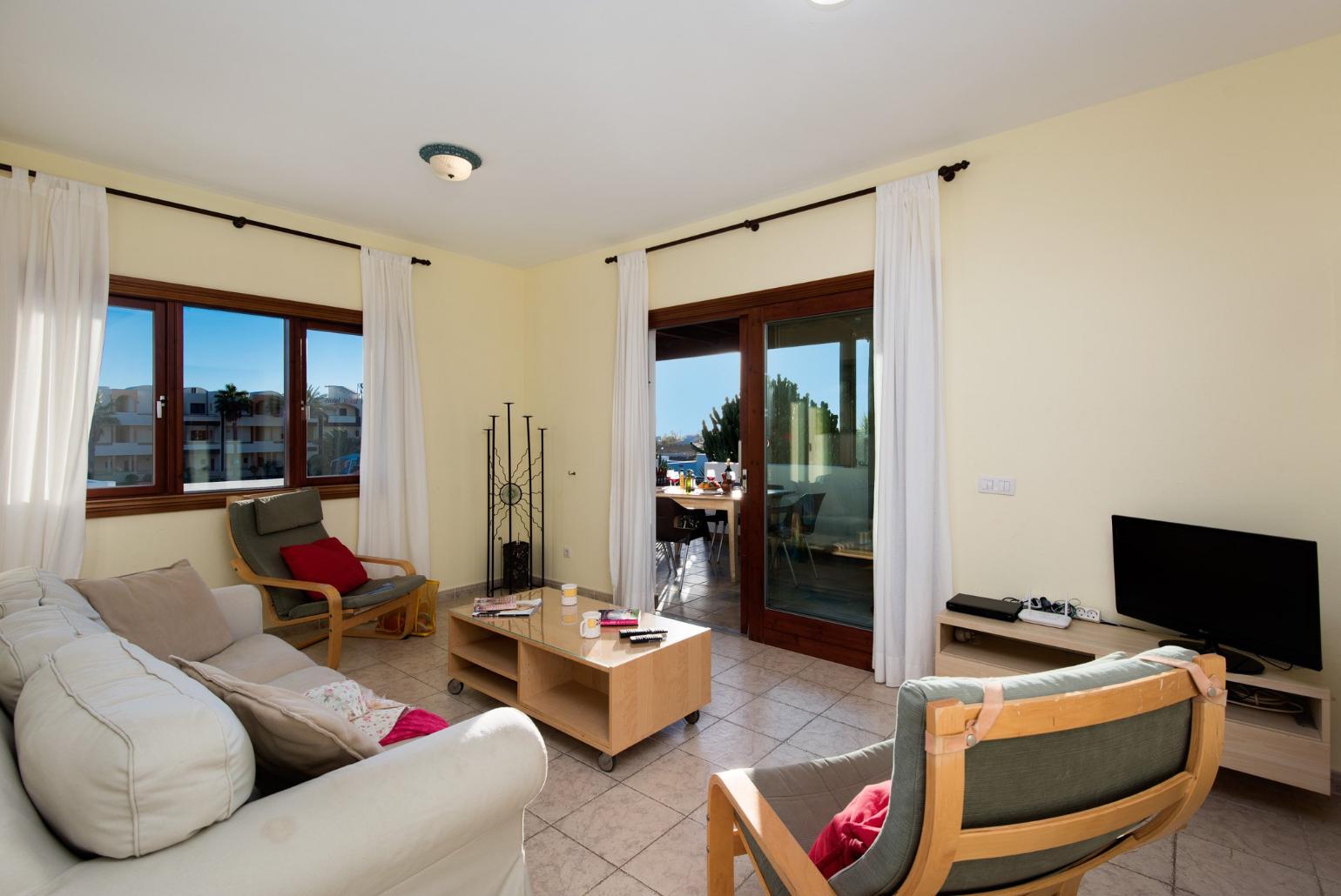Living room with WiFi, TV, DVD player and terrace access